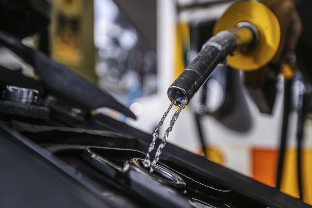 A man refuels his bike at a Shell petrol station in Chow Kit, Kuala Lumpur November 3, 2020. u00e2u20acu201d Picture by Hari Anggara