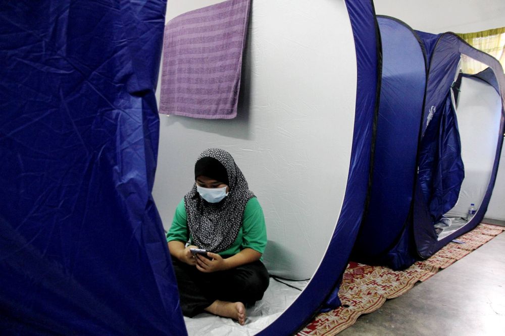 A woman is seen at a flood relief centre in Matang, Taiping November 21, 2020. u00e2u20acu201d Bernama pic