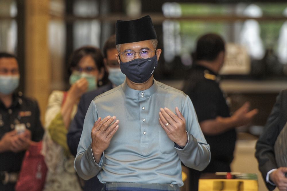 Datuk Seri Tengku Zafrul Abdul Aziz says prayers outside the Finance Ministry before leaving for Parliament to table Budget 2021 November 6, 2020. u00e2u20acu201d Picture by Shafwan Zaidon