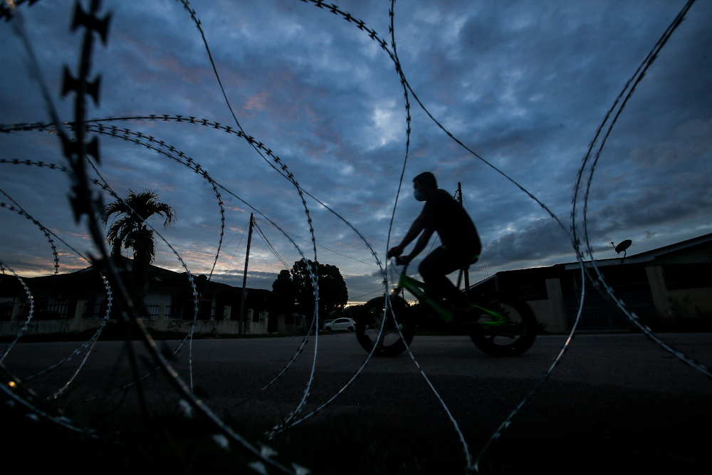 Residents of Taman Klebang Jayau00e2u20acu2122s Zone A are seen spending their times outside their homes after EMCO was enforced in the area since yesterday due to the spike in Covid-19 cases December 2, 2020. u00e2u20acu201d Picture by Farhan Najib