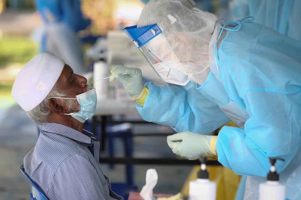 Health workers collect swab samples to test for Covid-19 at the Dewan Masyarakat Taman Meru 3 in Klang December 2, 2020. u00e2u20acu201d Picture by Yusof Mat Isa