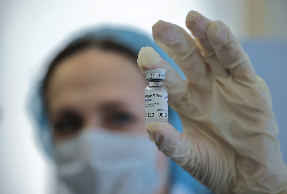 A medical worker demonstrates a vial with Sputnik V vaccine during the vaccination against the coronavirus disease at a clinic in Moscow, Russia December 5, 2020. u00e2u20acu2022 Reuters picnnn