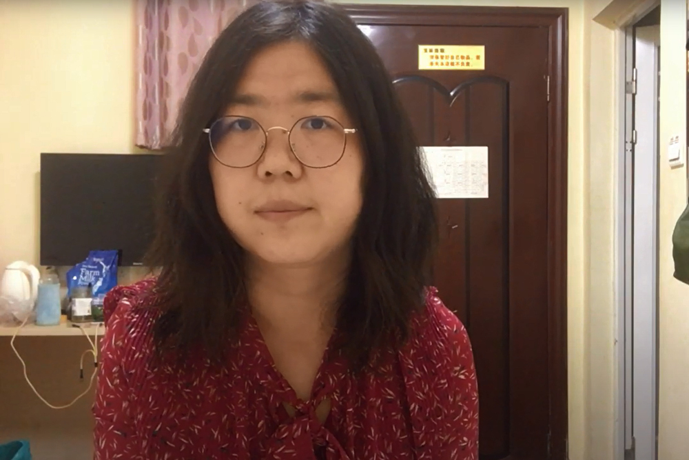 This screengrab taken on December 28, 2020 from an undated video showing former Chinese lawyer and citizen journalist Zhang Zhan as she broadcasts via YouTube, at an unconfirmed location in China. u00e2u20acu201d YouTube handout pic via AFP   nn