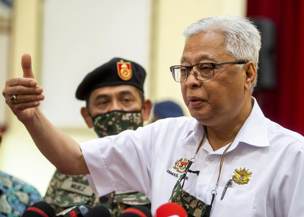 Ismail Sabri speaks to the media after handing out flood aid to victims at the camp in Pengkalan Chepa January 10, 2021. u00e2u20acu201d Bernama pic