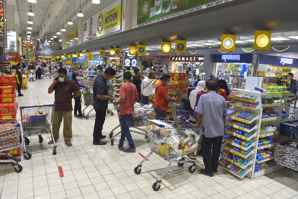 People shop for groceries at a supermarket in Subang Jaya a day before the movement control order (MCO) takes effect, January 12,2021. u00e2u20acu201d Picture by Miera Zulyana