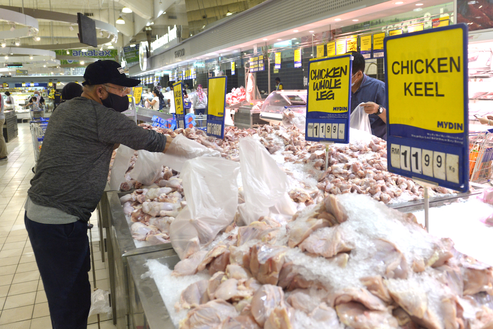 People shop for groceries at a supermarket in Subang Jaya a day before the movement control order (MCO) takes effect, January 12,2021. u00e2u20acu201d Picture by Miera Zulyana