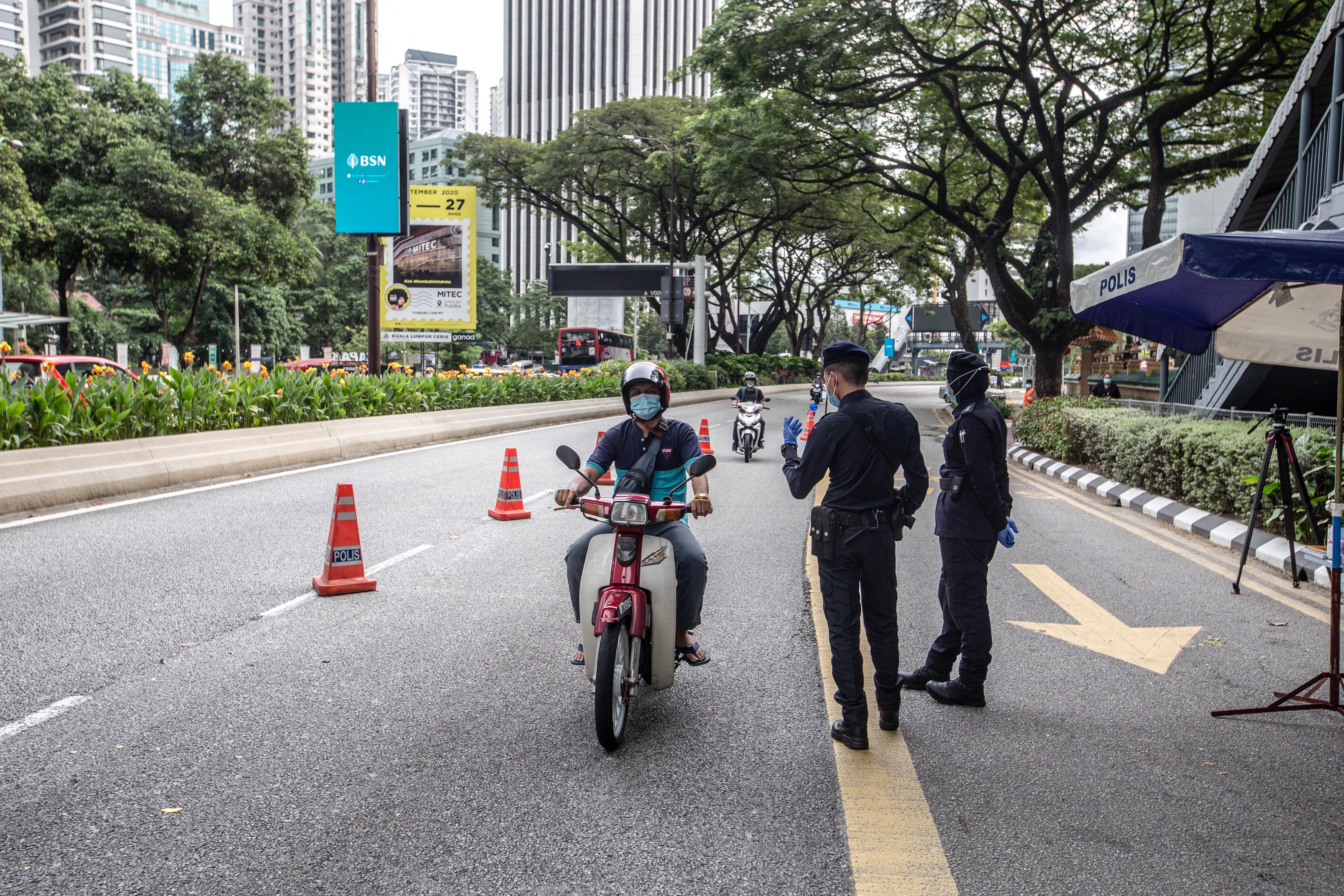 Soldiers and police officers conducting checks at a roadblock near Bukit Bintang in Kuala Lumpur January 13, 2021. u00e2u20acu201d Picture by Firdaus Latif