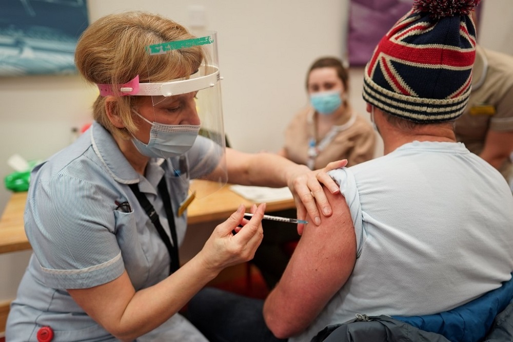 Key Worker Mark Reid from North Shields receives the Pfizer-BioNTech Covid-19 vaccine at the International Centre for Life in Newcastle upon Tyne January 9, 2021. u00e2u20acu201d AFP pic