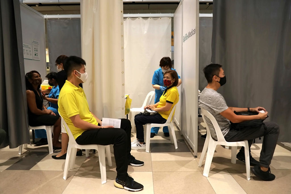 Front-line workers from the aviation and maritime sectors receive their Covid-19 vaccines at the vaccination centre at Changi Airport Terminal 4 on January 18, 2021. u00e2u20acu201d Picture by Nuria Ling/TODAY