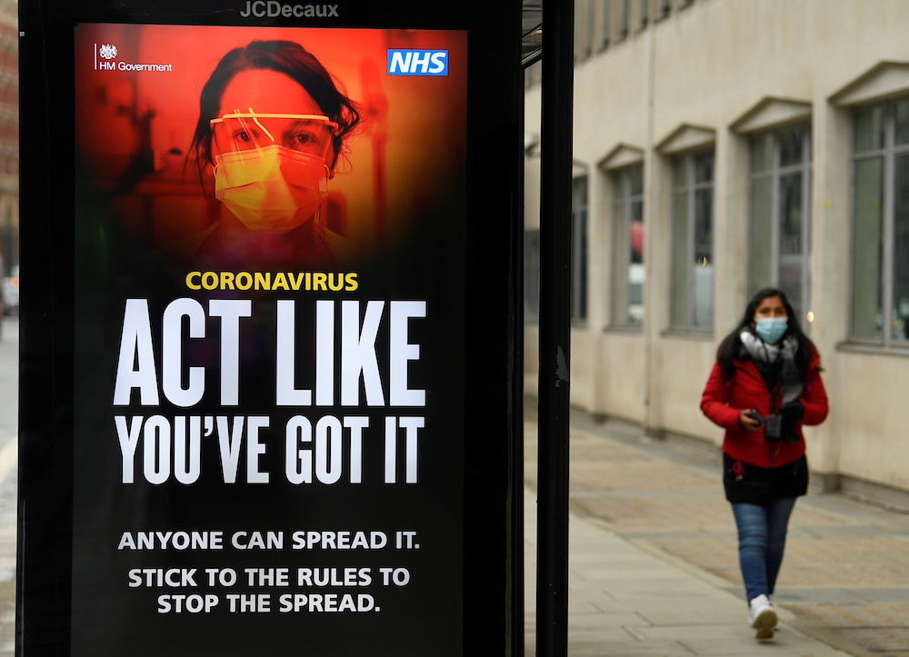 A British government public health information sign is seen on bus shelter amid the spread of the coronavirus disease (Covid-19), London, Britain, January 27, 2021.  u00e2u20acu201d Reuters pic
