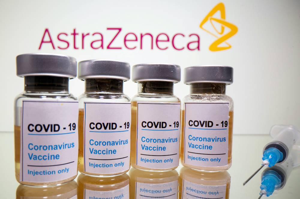 Vials with a sticker reading, u00e2u20acu02dcCovid-19 / Coronavirus vaccine / Injection onlyu00e2u20acu2122 and a medical syringe are seen in front of a displayed AstraZeneca logo in this illustration taken October 31, 2020. u00e2u20acu2022 Reuters picnnn