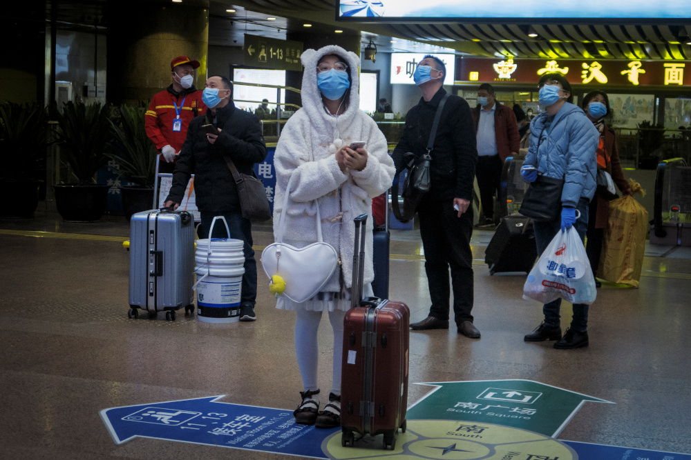 Travellers wear face masks at a train station following the outbreak of the coronavirus disease in Beijing, China, January 13, 2021. u00e2u20acu201d Reuters picnn