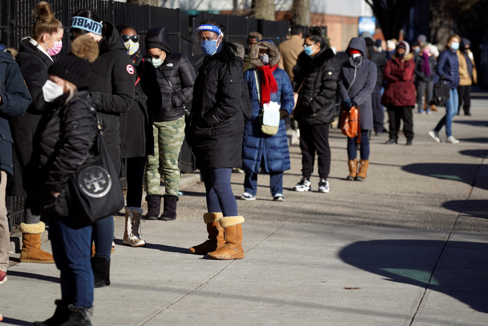 People line up to receive a dose of the Moderna coronavirus disease vaccine at a mass vaccination site at South Bronx Educational Campus, in the Bronx borough of New York City, New York, US, January 10, 2021. u00e2u20acu201d Reuters pic 