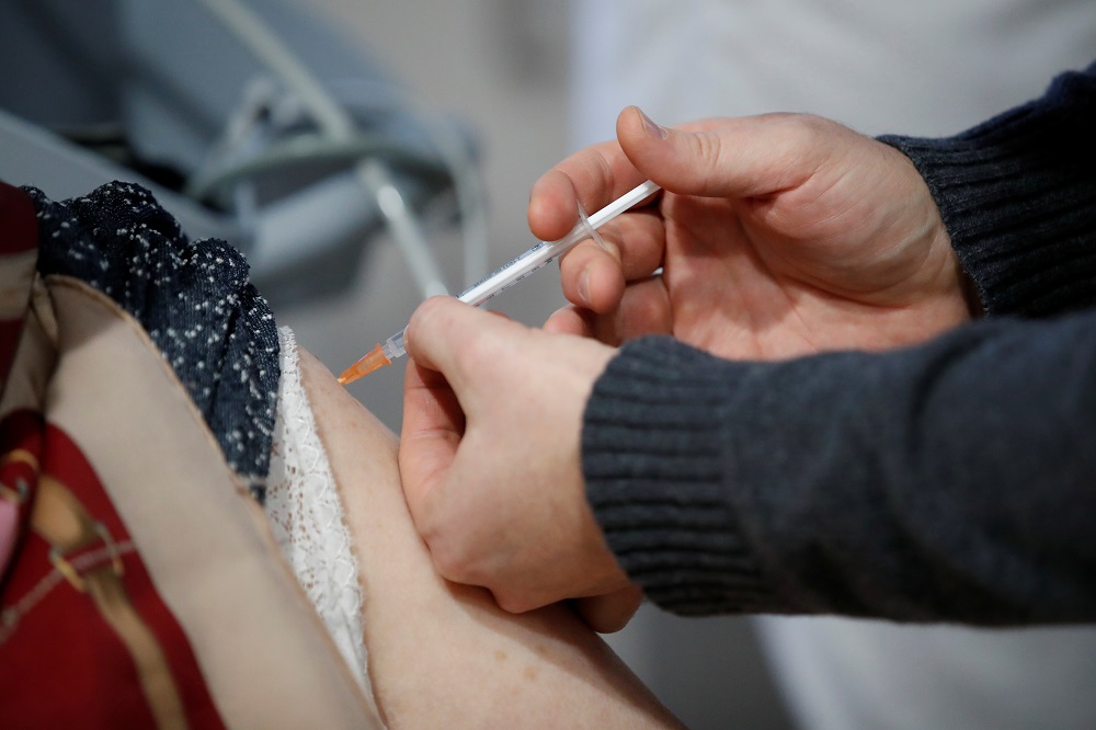 A resident receives a dose of the Pfizer-BioNTech Covid-19 vaccine at the EHPAD (care home and day centre for elderly people) of the Le Jeune hospital in Saint-Renan near Brest in France January 4, 2021. u00e2u20acu2022 Reuters pic