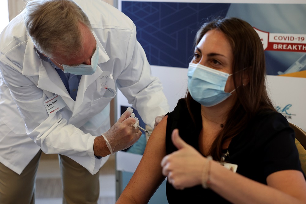 A staff member at Hamilton Park Nursing and Rehabilitation, a nursing home facility, receives the Pfizer-BioNTech coronavirus disease vaccine from Walgreens Pharmacist Craig Brandt in Brooklyn January 4, 2021. u00e2u20acu2022 Reuters pic