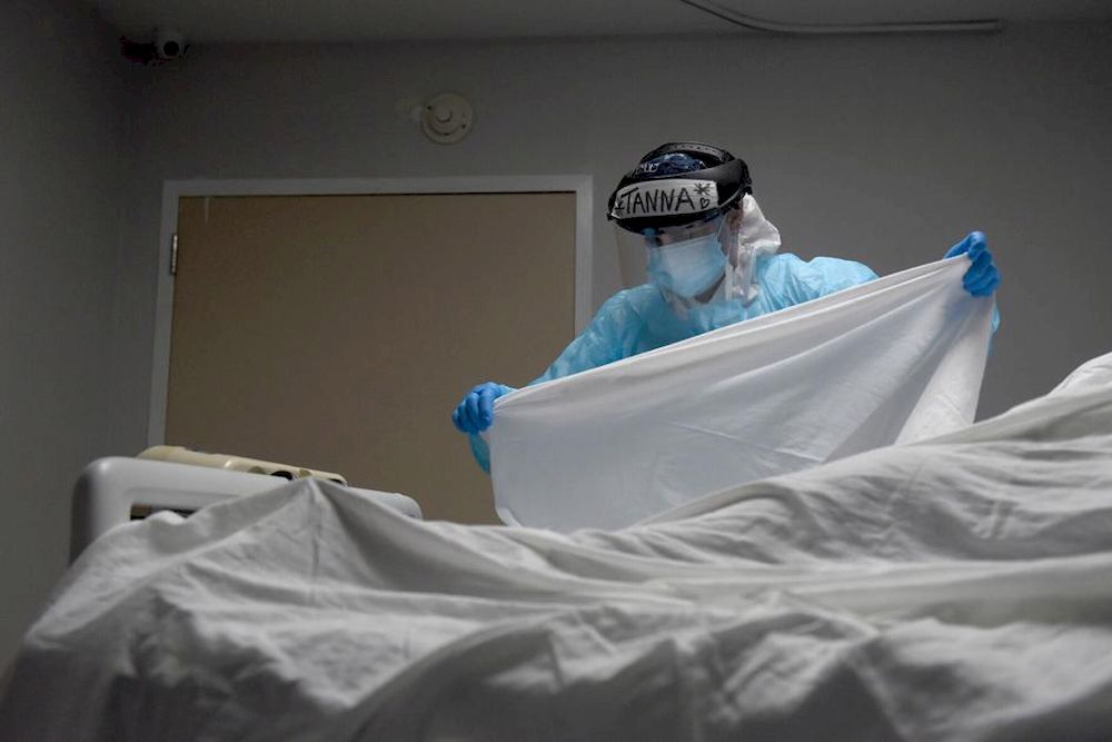 Tanna Ingraham places a sheet over the body of a patient who died inside the coronavirus disease (Covid-19) unit at United Memorial Medical Center in Houston, Texas, US, December 30, 2020. u00e2u20acu201d Reuters pic