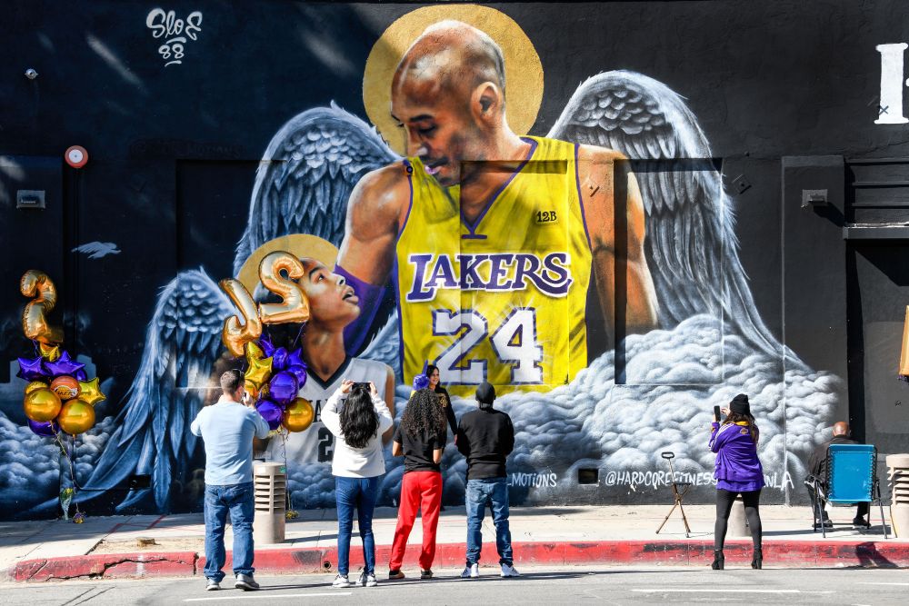 Fans gather at a mural of Kobe Bryant and his daughter Gianna painted on the wall of Hardcore Fitness Bootcamp gym in downtown Los Angeles January 26, 2021. u00e2u20acu201d Reuters pic
