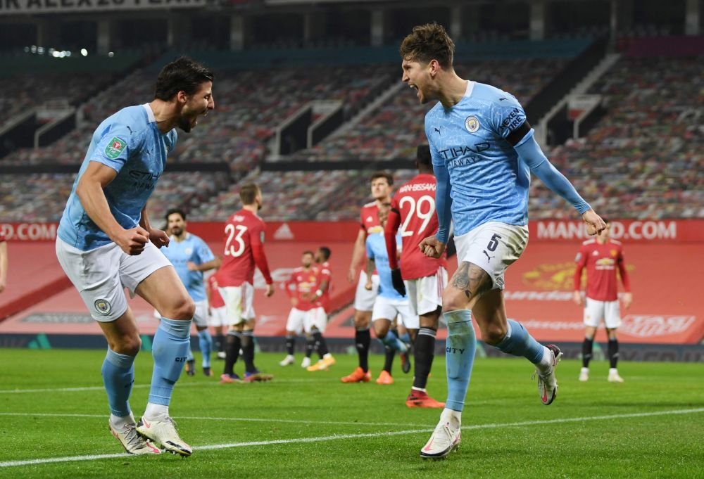 Manchester City's John Stones (right) celebrates scoring their first goal against Manchester United at Old Trafford January 6, 2021. u00e2u20acu201d Reuters picnn