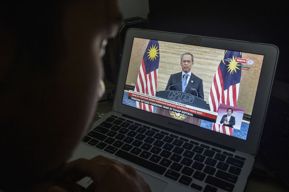 A man watches a live telecast of Prime Minister Tan Sri Muhyiddin Yassin's speech in Kuala Lumpur January 12, 2020. u00e2u20acu201d Picture by Miera Zulyana