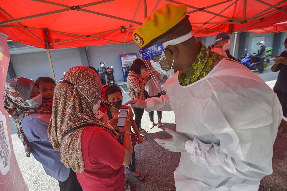 Health workers test members of the public for Covid-19 at Dewan MBSA Seksyen 19 in Shah Alam February 17, 2021. u00e2u20acu201d Picture by Miera Zulyana