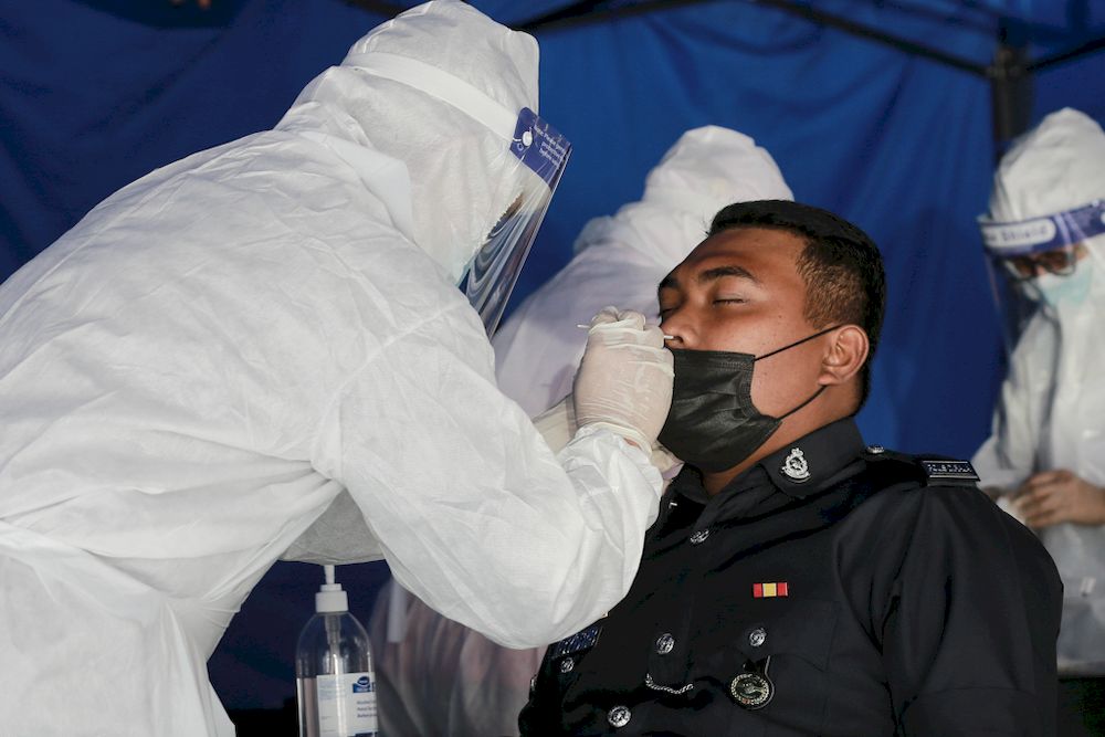 About 100 police personnel at IPD Ampang Jaya are administered the nasal swab test on February 25 2021 after 11 of person tested Covid-19 positive the previous day. u00e2u20acu201d Picture by Ahmad Zamzahuri