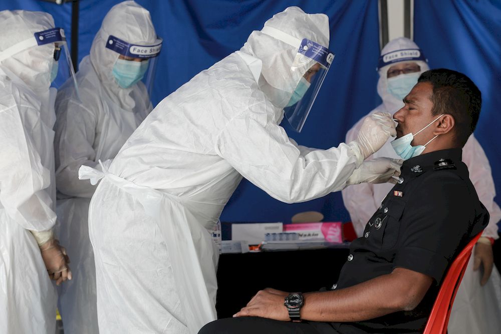 About 100 police personnel of IPD Ampang Jaya are administered the nasal swab test on February 25 2021 after 11 of person tested Covid-19 positive the previous day. u00e2u20acu201d Picture by Ahmad Zamzahuri