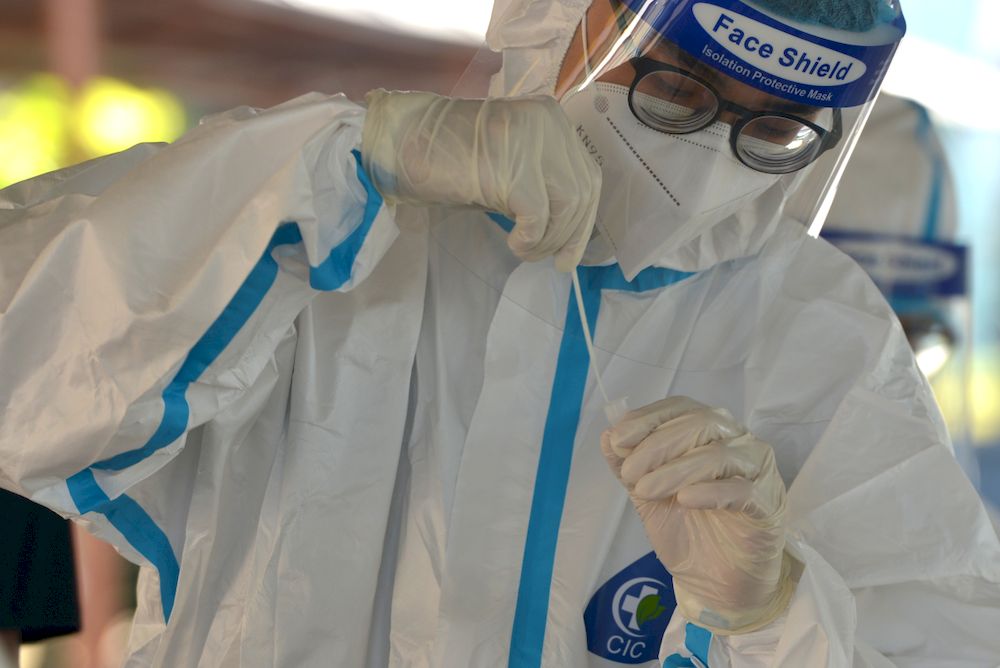 A health worker preparing to administer a Covid-19 test in Puchong, February 28,2021. u00e2u20acu201d Picture by Miera Zulyana