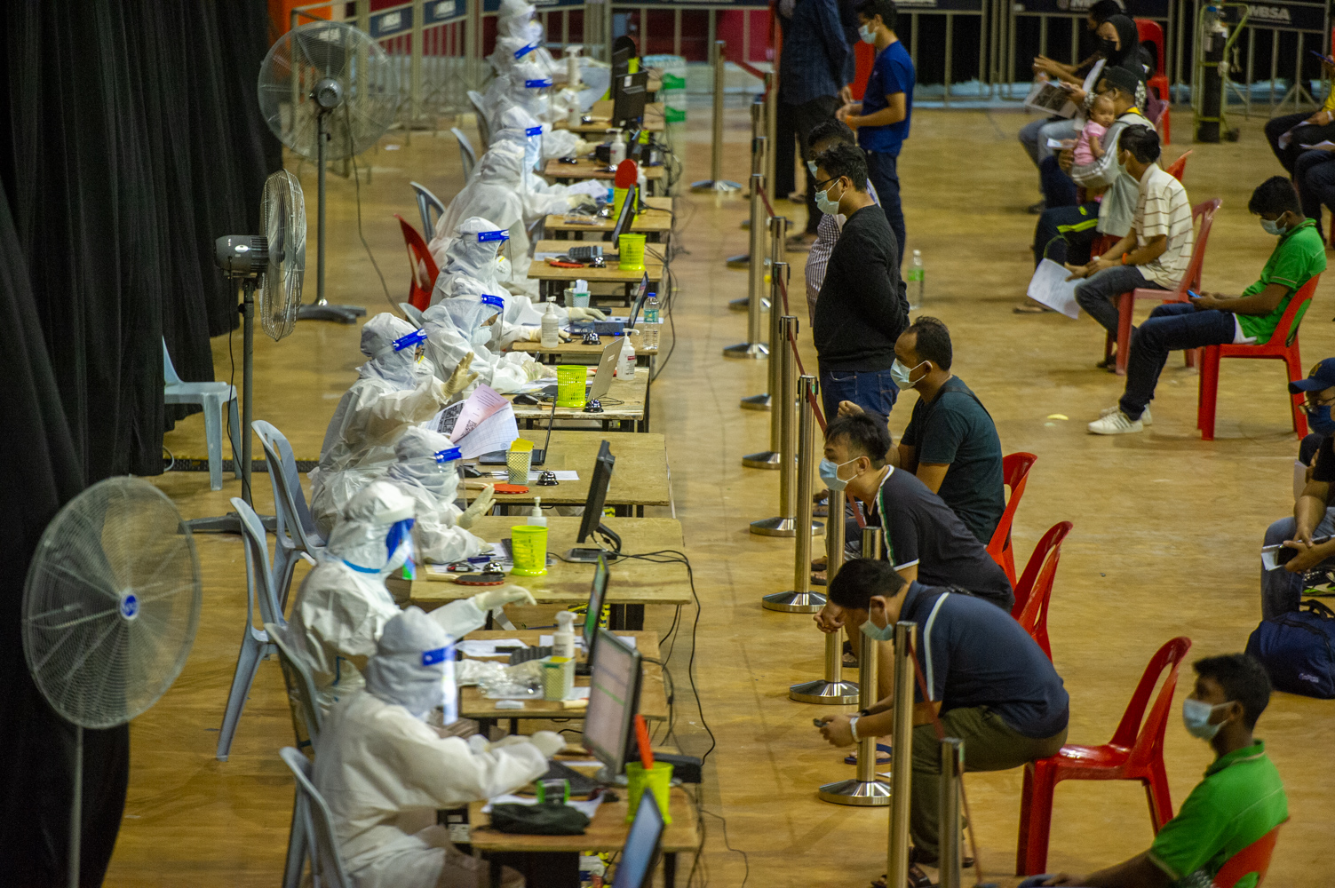 Members of the public suspected of being positive for Covid-19 getting tested at the Covid-19 Assessment Center (CAC), Malawati Stadium in Shah Alam, February 8, 2021. u00e2u20acu201d Picture by Shafwan Zaidon