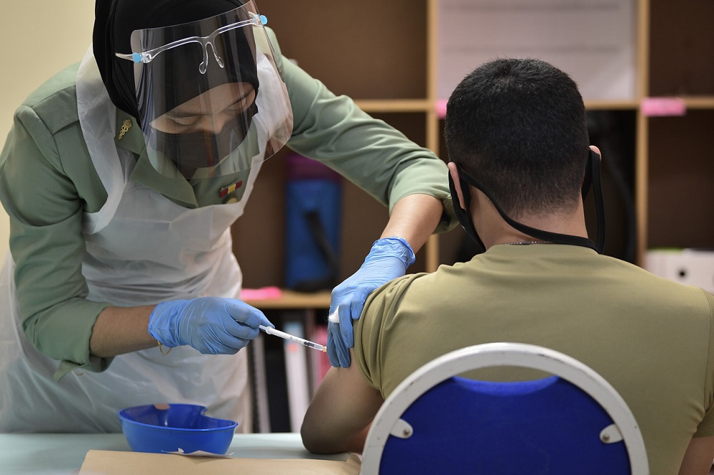 An army personnel receives the Pfizer-BioNTech Covid-19 vaccine at Hospital Angkatan Tentera (HAT) Tuanku Mizan in Kuala Lumpur February 26, 2021. u00e2u20acu2022 Bernama pic