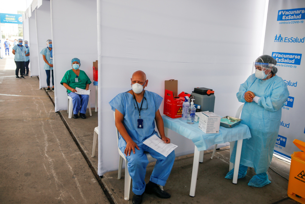 Health workers wait for a dose of the Sinopharmu00e2u20acu2122s coronavirus disease vaccine in Lima, Peru, February 9, 2021. u00e2u20acu201d Reuters pic 