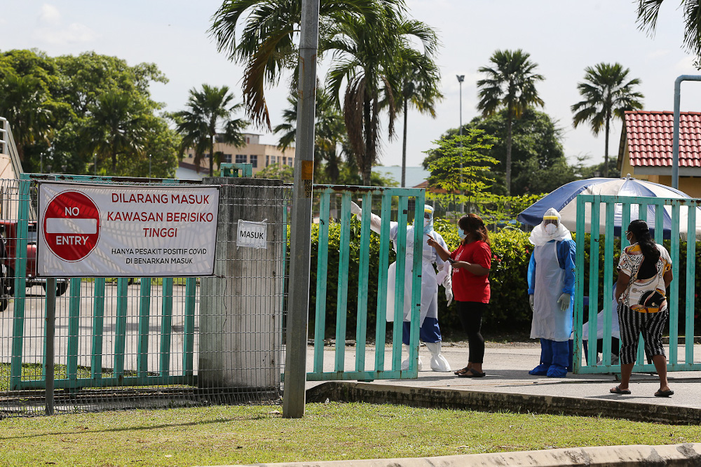 Covid-19 patients are seen at the entrance of Covid-19 Assessment Centres (CAC) at Stadium Hoki Pandamaran in Klang February 2, 2021. u00e2u20acu201d Picture by Yusof Mat Isa