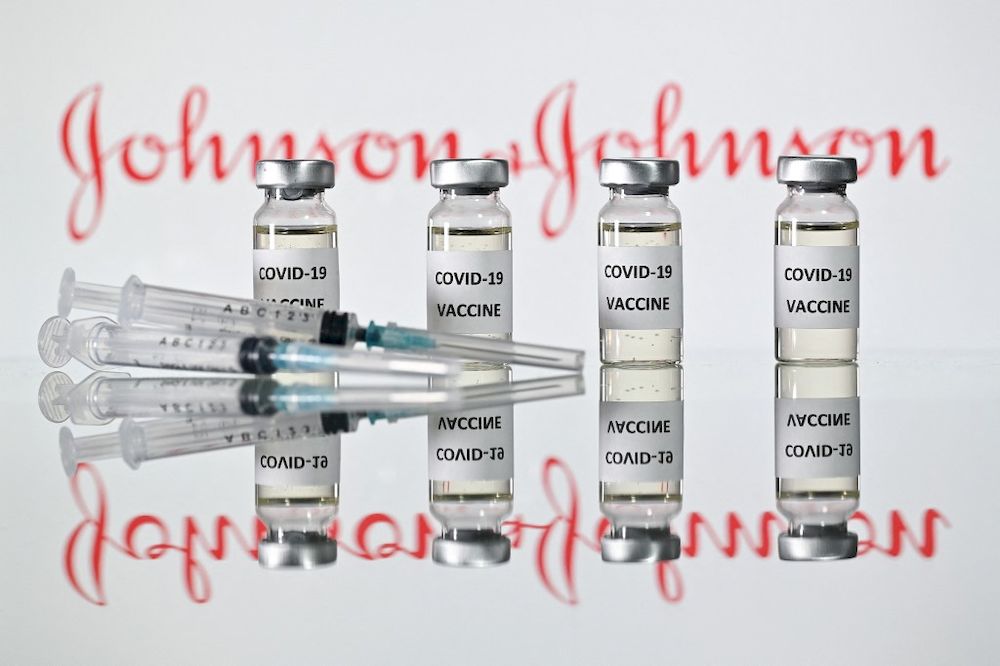 A file photo taken on November 17, 2020 shows vials with Covid-19 Vaccine stickers attached and syringes with the logo of US pharmaceutical company Johnson & Johnson in London. u00e2u20acu201d AFP pic
