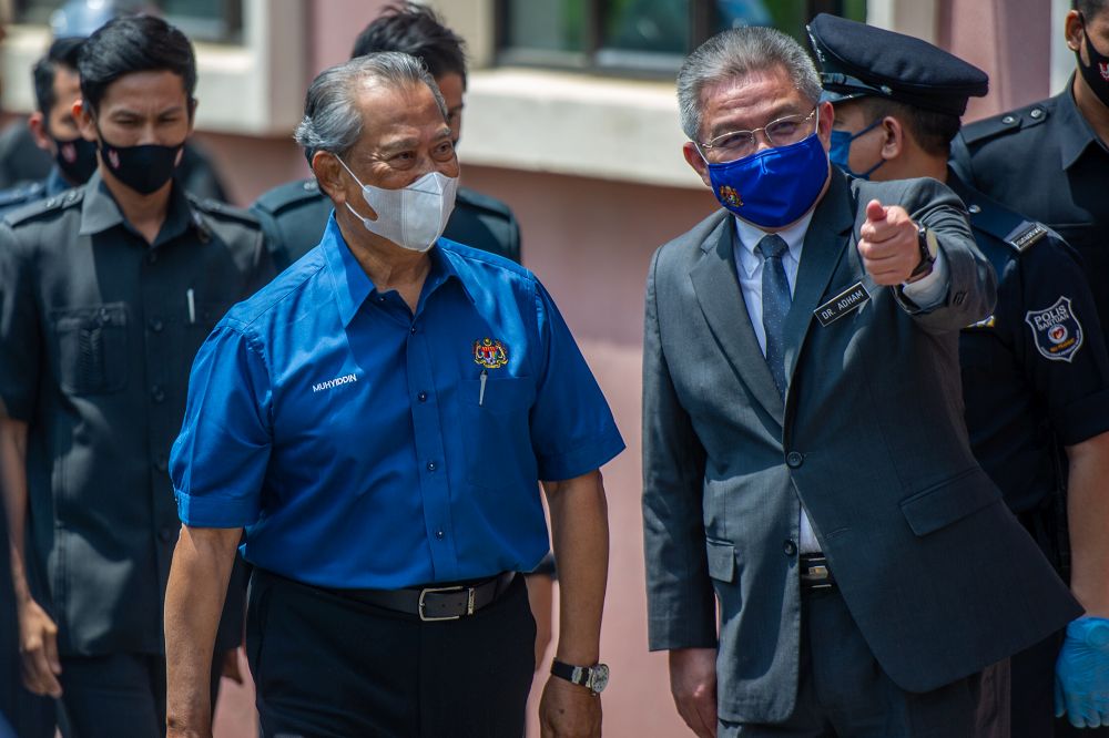 Prime Minister Tan Sri Muhyiddin Yassin and Health Minister Datuk Seri Dr Adham Baba are pictured at the National Covid-19 Immunisation programme launch in Putrajaya February 24, 2021. u00e2u20acu2022 Picture by Shafwan Zaidon