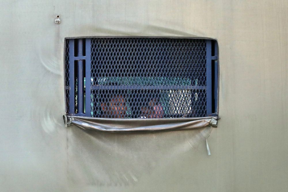 Myanmar migrants to be deported from Malaysia are seen inside an immigration truck, in Lumut February 23, 2021. u00e2u20acu2022 Reuters pic