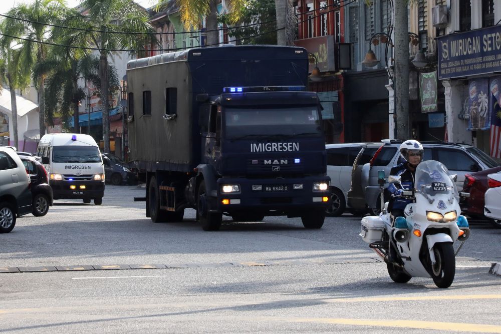 An immigration truck carrying Myanmar migrants to be deported from Malaysia is seen in Lumut February 23, 2021. u00e2u20acu201d Reuters pic