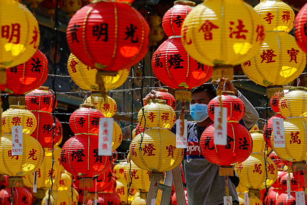 Workers seen wearing face masks as they touch up the ground with lanterns in conjunction with the upcoming Chinese New Year celebration at Kek Lok Si Temple, February 4, 2021. u00e2u20acu201d Picture by Sayuti Zainudin