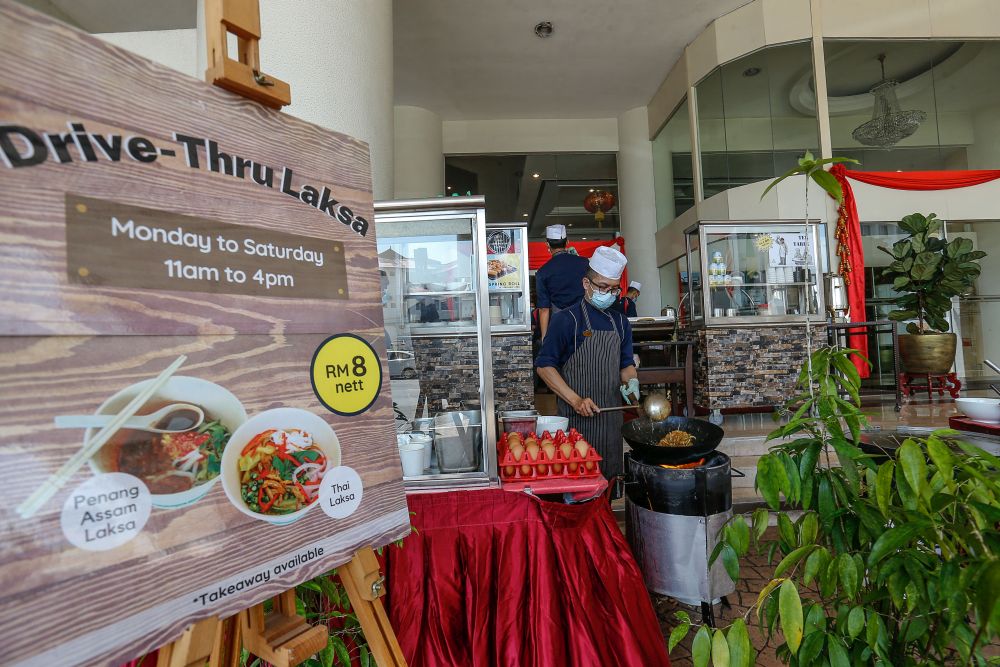 Cititel Penang has set up hawker stalls outside its premises to draw in the crowd amid the movement control order in George Town February 3, 2021. u00e2u20acu201d Picture by Sayuti Zainudin