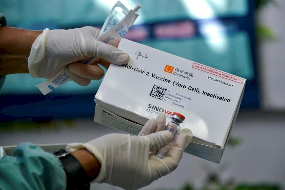 A health worker prepares to administer the Sinovac vaccine against the Covid-19 coronavirus at a community health centre in Banda Aceh on Feb 6, 2021. u00e2u20acu201d AFP pic