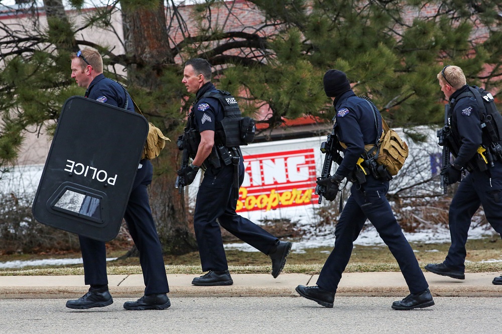 Law enforcement officers sweep the parking lot at the site of a shooting at a King Soopers grocery store in Boulder, Colorado March 22, 2021. u00e2u20acu201d Reuters pic