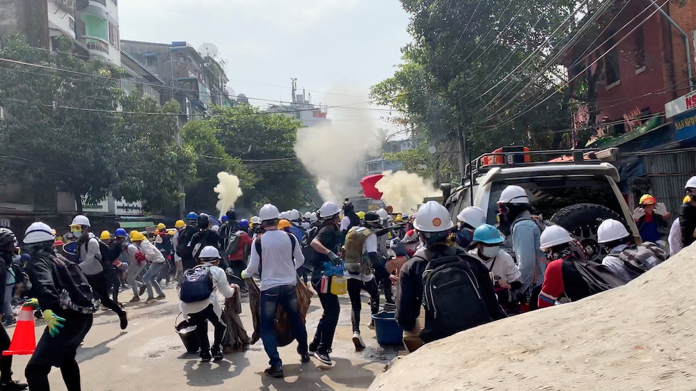 Protesters set off smoke grenades to block the view from snipers in Sanchaung, Yangon, Myanmar March 3, 2021, in this still image from a video obtained by Reuters. u00e2u20acu201d Reuters picnn