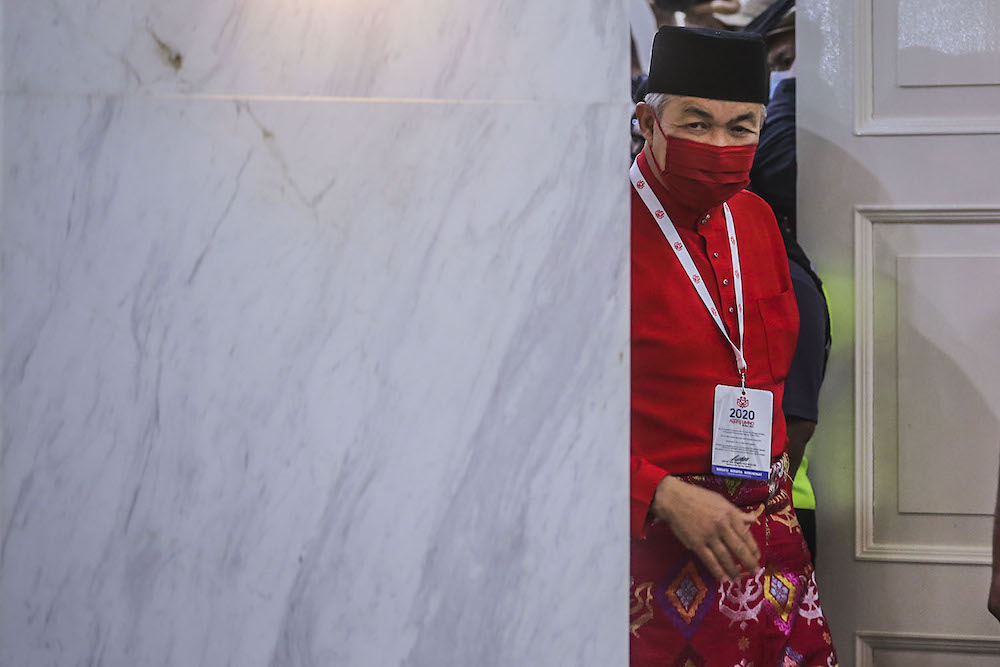 Umno president Datuk Seri Ahmad Zahid Hamidi (centre) speak to reporters during the press conference at the 2020 Umno annual general meeting in Kuala Lumpur March 28, 2021. u00e2u20acu2022 Picture by Hari Anggarann