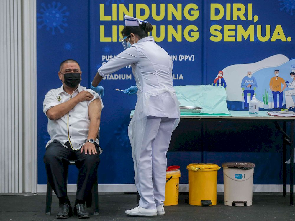 Perak Mentri Besar Datuk Saarani Mohamad receiving the Covid-19 vaccine at the at vaccination centre (PPV) at the Indera Mulia Stadium in Ipoh, March 1, 2021. u00e2u20acu201d Picture by Farhan Najib
