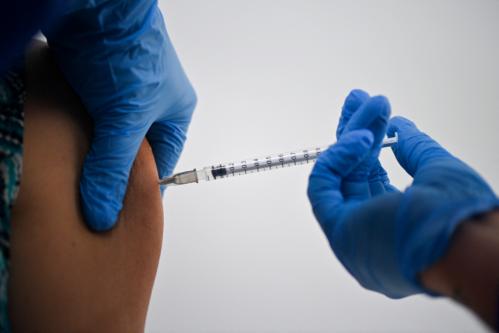 A health worker receives a dose of the Pfizer-BioNTech vaccine against Covid-19 at the Versalles Clinic, in Cali, Colombia, amid the novel coronavirus pandemic February 19, 2021. u00e2u20acu201d AFP pic 