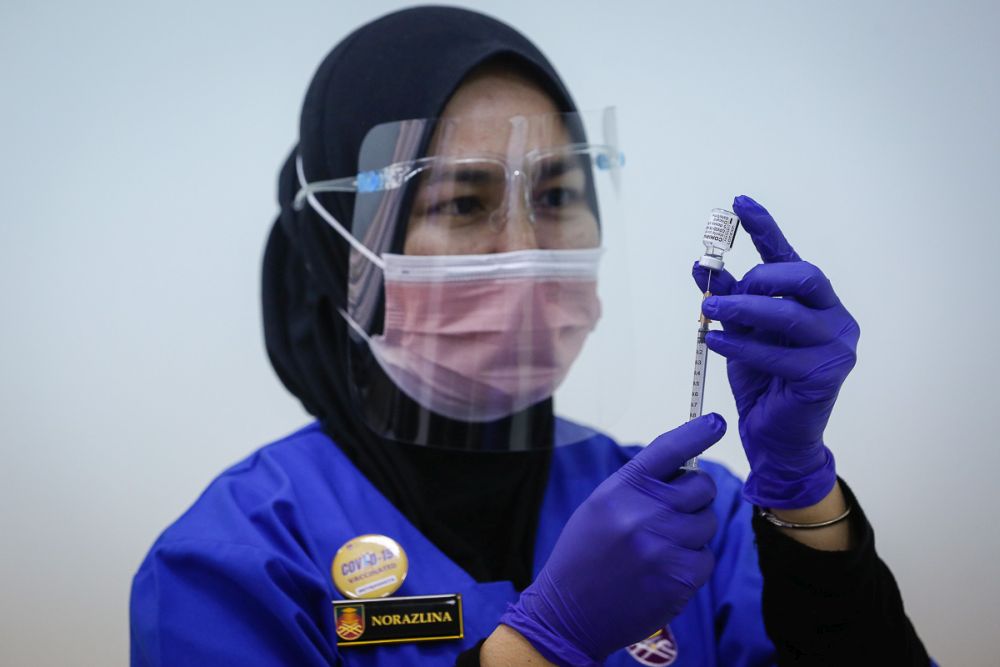A nurse loads a syringe with a dose of the Pfizer-BioTech Covid-19 vaccine at the UiTM Hospital in Sungai Buloh March 2, 2021. u00e2u20acu201d Picture by Yusof Mat Isa