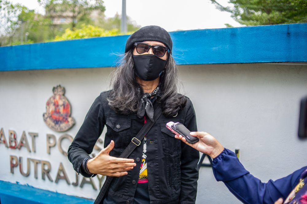 Activist Fahmi Reza speaks to a reporter outside the Putrajaya district police headquarters March 10, 2021. u00e2u20acu201d Picture by Shafwan Zaidon