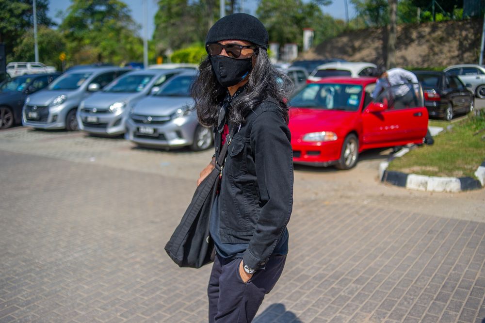 Activist Fahmi Reza arrives at the Putrajaya district police headquarters March 10, 2021. u00e2u20acu201d Picture by Shafwan Zaidonnn