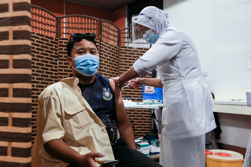 Frontliners receive the first dose of the Covid-19 Pfizer vaccine at the Sunway Pyramid Convention Centre March 11, 2021. u00e2u20acu2022 Picture by Ahmad Zamzahuri