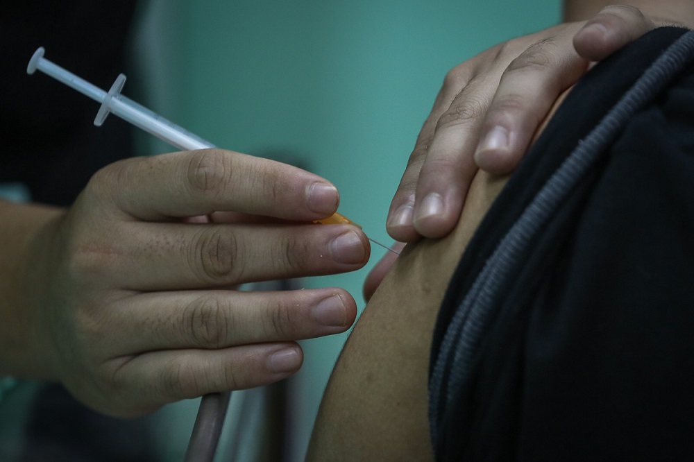 A health worker receives the Pfizer-BioNTech Covid-19 vaccine at the Klinik Kesihatan in Kelana Jaya March 6, 2021. u00e2u20acu2022 Picture by Yusof Mat Isa