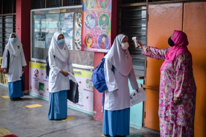 Some teachers are having to handle accommodating Form Five students at school and conducting online classes as well.  u00e2u20acu2022 Picture by Firdaus Latif