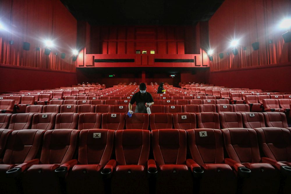 Workers disinfect cinema seats at TGV Bukit Tinggi, Klang March 4, 2021. u00e2u20acu201d Picture by Yusof Mat Isa